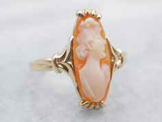 "Cameo is the art of carving a layered material, creating a portrait or landscape in the differing colors and textures. Shell is the traditional medium for this artwork. Metal: 10K Yellow Gold Gem: Shell Cameo Gem Measurements: 6.2 x 16.8 mm, Oval Ring Size: 5.75 Marks: \"DASON10KP\" Stamped on the inside band To view a video of this piece check out the link below: https://vimeo.com/808345561 SKU#: A23552 Each piece has been identified and graded by a Graduate Gemologist who has been certified b Black Hills Gold Rings, Light Blue Sapphire, Garnet And Diamond Ring, Right Hand Ring, Pink Tourmaline Ring, Black Hills Gold, Engagement Ring Diamond Cut, Cameo Ring, Sapphire Engagement Ring Blue