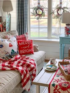 a living room filled with furniture and christmas decorations