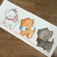 a drawing of three different animals on a piece of paper with watercolor pencils