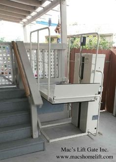 stairs leading up to the upper level of a house with metal railings and handrails