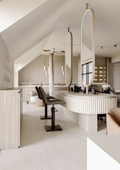 the interior of a hair salon with chairs and mirrors on the wall, along with an open floor plan