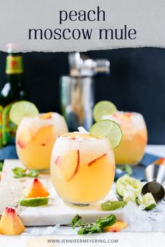 two glasses filled with peach moscow mules