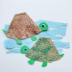 two paper turtles made out of construction paper