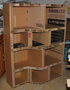 cardboard boxes stacked on top of each other in a kitchen