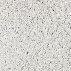 a white textured wallpaper with small dots