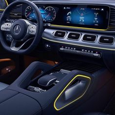 the interior of a mercedes c - class coupe with yellow and black trimmings