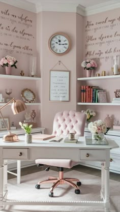 a white desk topped with a pink chair next to a wall covered in writing on it