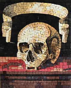 a painting on the side of a brick wall with a skull and knife in it