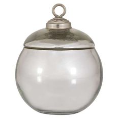 a glass jar with a metal lid on a white background