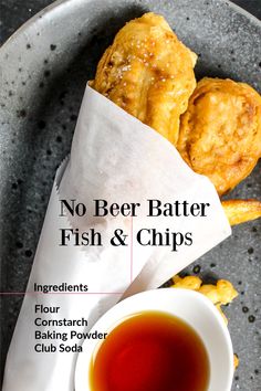 no beer batter fish and chips on a plate with dipping sauce in a small bowl