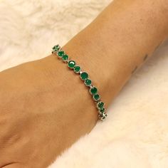 This elegant green onyx faceted gemstone bracelet is a must-have accessory for any jewelry lover. Handcrafted with care, this silver plated tennis bracelet adds a touch of sophistication to any outfit 🌟. Gemstone- Green Onyx Gemstone Shape - Round weight - 13 gm approx. Stunning green onyx gemstones, faceted for extra sparkle ✨ High-quality silver plating for a luxurious finish Handcrafted design ensures each bracelet is unique Secure clasp for easy wear and peace of mind Perfect for gifting or adding to your personal collection Enhance your jewelry collection with this exquisite green onyx bracelet, designed to shine on every occasion. We accept custom and personalized order. It can be change in the gemstone, ring design and ring size. Please send us message if you are interested in a cu Green Gemstone Bracelet For Weddings, May Birthstone Crystal Gemstone Bracelet, Green Round Birthstone Bracelet, Green Sterling Silver Beaded Bracelets, Elegant Green Crystal Gemstone Bracelet, Anniversary Green Gemstone Bracelet, Silver Emerald Bracelets For May Birthstone, Silver Bracelet With Emerald For May Birthstone, Elegant Green Faceted Crystal Bracelet