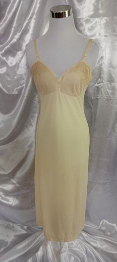 Brand: JC Penney Type of Clothing: Women's Full Slip Condition: Very good condition Details: Vintage beautiful full slip nightgown. Soft, silky and lightweight. Adjustable straps, Lace trimmed. One Side slit up to 9" cut. Made in USA. Materials: Antron Nylon III Color: Beige/ Cream Size: 34/12 LL Actual Measurements (Approximate laid flat) Shoulder to Bottom Hem- 46" (adjustable shoulder straps) Underarm to Bottom Hem- 36" Underarm to Underarm- 15.5" Slip Nightgown, Lace Slip Dress, Lace Slip, Night Gown, Shoulder Straps, Lace Trim, Favorite Outfit, Made In Usa, Slip Dress