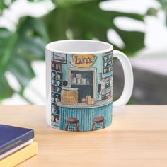 a coffee mug sitting on top of a wooden table