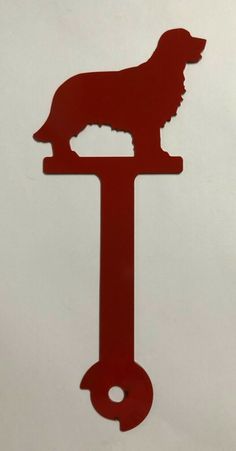 a red key with a dog on it