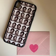 a phone case with an image of martin luther king on it next to a pink envelope