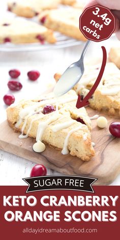 a person is cutting up some cranberry orange scones on a wooden board