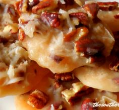 a close up of food on a plate with pecans and other things in the background