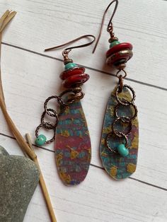 I call this pair Fall Lake. The polymer clay ovals are in  my favorite colors of Aqua and rust. A delicate chain adds interesting movement to this pair. They are 2-3/4 inches long with Brass findings and ear wires. Turquoise Bohemian Polymer Clay Earrings, Bohemian Turquoise Polymer Clay Earrings, Turquoise And Rust, Fall Lake, Autumn Lake, Metal Works, Metal Words, Delicate Chain, Vintage Tin