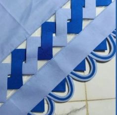 some blue and white paper on a tile floor