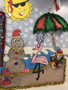 a decorated wall in the shape of a snowman, flamingo and christmas tree