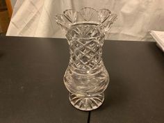 a clear glass vase sitting on top of a table