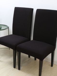 two black chairs sitting next to each other