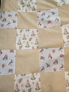 the quilt is made up to look like it has many rabbits on it and polka dots