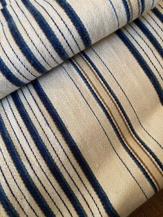 two blue and white striped fabric on top of each other