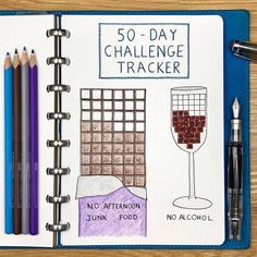 a notebook with some drawings on it and two pens in front of the page that says 50 - day challenge trackerr