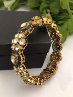 Material:  brass, Cz Stone, Kundan Polk Stunning Gold Bracelet with Royal and Elegant look. You can wear this with any kind of outfits like Kurtis, lehanga, Sarees and Trousers and Denims. Most eligible gift for someone you love and someone very special for you. Best gift for your anniversary. Best gift for her Birthday. Bracelet : 1 Arrives in a small plastic box. For any queries please contact me. Kundan Bracelets With Intricate Design For Celebration, Kundan Openable Round Bracelet, Silver Kundan Bracelet With Meenakari, Silver Kundan Bracelet With Meenakari Details, Jadau Bracelet, Kundan Bracelet, Jewelry Royal, Sabyasachi Jewellery, Birthday Bracelet