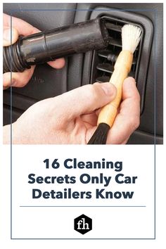 a person is cleaning the interior of a car with a brush and cleaner's glove