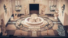 an elaborately decorated room with statues and flowers