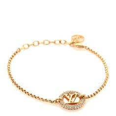 This is an authentic LOUIS VUITTON Metal Crystal Louise By Night Bracelet in Gold. This polished gold-toned bracelet features adjustment links and a crystal encrusted hoop with an LV in the center. Louis Vuitton Jewelry, Bracelet Gold, Authentic Louis Vuitton, Diamond Bracelet, Gold Bracelet, Louis Vuitton, Things To Sell, Bracelet, Crystals