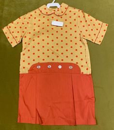 "Vintage gold and orange Girls dress with Peter Pan collar and buttons at waist. Polka dot bodice. . Size 10, 33\" chest, 30\" from top of shoulder to bottom hem. 13.5\" shoulder to shoulder, 34\" waist. 100% cotton. Old stock with original tags, unworn. Excellent condition!" Girls Orange Dress, Dress With Peter Pan Collar, 70s Girl, Pan Collar Dress, Peter Pan Collar Dress, Vintage Swim, Vintage Girls, Pan Collar, Plaid Dress