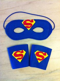 two pieces of felt with the shape of a superman mask