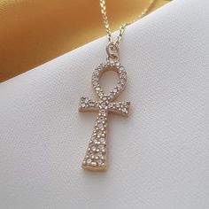 14k Solid Gold Ankh Necklace, Cross Necklace, Guardian Angel, Religious Necklace, Ankh Charm Necklace, Christian Cross,Gift Necklace For Her The necklace is made with 14k solid gold.. All the pieces in the necklace are solid gold..                                                              We use lobster clasp on the chain..         The chain thickness is 0.85mm.    Gemstone: Cubik Zirconia Pendant height: 21 mm  Pendant width : 9 mm The chain is produced adjustable..  For example: 22 inches adjustable 21 inches, 20 inches adjustable 19 inches, 18 inches adjustable 17 inches, 16 inches adjustable 15 inches Gold Ankh Hallmarked Jewelry, Hallmarked Yellow Gold Ankh Jewelry, Gold Symbolic Gemstone Necklace, Symbolic Gold Necklace With Gemstone, Luxury Gold Ankh Jewelry, Elegant 14k Gold Ankh Jewelry, Gold Ankh Necklace Hallmarked, Handmade Gold Ankh Necklace, Handmade Ankh Gold Necklace