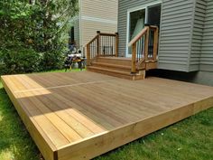 a wooden deck in front of a house