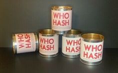 four tins with the words who hash written on them are sitting on a table