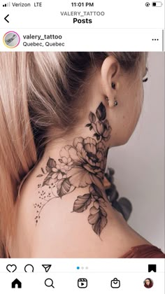 a woman's neck tattoo with flowers on it