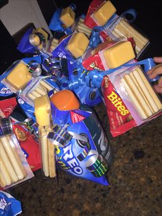 a pile of cheese sticks and other snacks