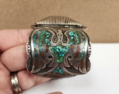 This rare watch is dated from the 1960s to 1970s, and features two beautiful peyote water birds, one on each side of the watch face. It is handmade Indian Jewelry (HMIJ) made of sterling silver, coral, and turquoise. You will see that it has been marked with the Sun God Face, HMIJ, and the artist's mark (B. James) indicating its authenticity as a handmade item. James is a Navajo Silversmith. SAVE ON SHIPPING ALL ITEMS ARE AVAILABLE FOR PICK UP IN BLOOMINGTON, IN. If you would like to set up a pi Water Birds, Turquoise Jewelry Native American, Sun God, Native American Turquoise, American Turquoise, Turquoise Jewelry, Silver Watch, Indian Jewelry, Turquoise Bracelet