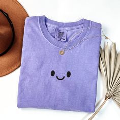 Comfort Colors Smiley Face T-Shirt, Embroidered Kawaii Shirt, Embroidered Smiley Face Shirt, Cute Kawaii T-shirt This embroidered smiley face shirt is everything. Perfect to wear or give as a gift! ✨ 100% Cotton ✨ Pre-shrunk ✨ Relaxed fit Care: Machine wash: warm (max 40C or 105F) Tumble dry: low Do not iron directly on the design REFUNDS AND EXCHANGES All items are made to order using multiple suppliers to ensure quick worldwide shipping. For this reason we are unable to accept returns/exchange Alabama T Shirts, Floral Embroidered Shirt, Smiley Face Shirt, Columbine Flower, Dapple Dachshund, Rose Shirts, Clover Flower, Butterfly Shirts, Georgia State