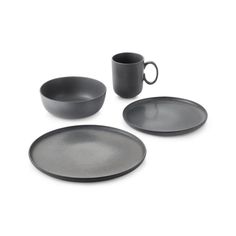 three black plates and two cups on a white surface