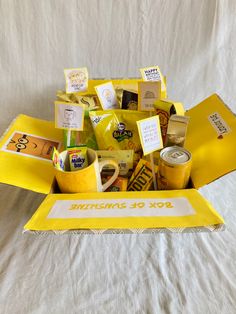 a yellow box filled with coffee and snacks