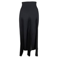 This one-of-a-kind Christian Dior skirt is crafted from a luxurious viscose blend in a timeless black hue. Its sleek and fitted silhouette features a high-waisted design with a discreet back zipper. The defining feature is the accordion pleat details in silk that lend it an effortless elegance. Dior Skirt, Hem Skirt, John Galliano, Harper's Bazaar, Helmut Lang, Cami Tops, Christian Dior, Ready To Wear, Dior