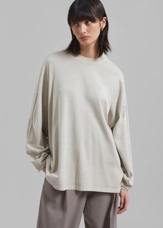 Color: Beige Lightweight cotton fleece Relaxed fit Crew neckline Long sleeves Drop shoulders Slip on style Unlined 100% Cotton Machine Wash Cold By The Frankie Shop. Imported Oversized T-shirt With Ribbed Cuffs For Loungewear, Oversized Cotton Top With Shirttail Hem, Long Sleeve Tops With Ribbed Neckline And Relaxed Fit, Oversized Relaxed Crew Neck Top, Cotton Tops With Ribbed Cuffs For Loungewear, Drop Shoulder Tops With Ribbed Cuffs For Loungewear, Oversized T-shirt With Ribbed Cuffs, Relaxed Long Sleeve T-shirt For Fall, Relaxed Long Sleeve T-shirt For Spring