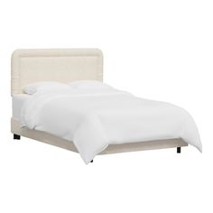 a bed with white linens and pillows on top of the headboard, in front of a white background