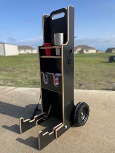 a small cart that has some cups on it