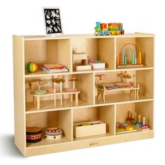 a wooden toy shelf filled with lots of toys