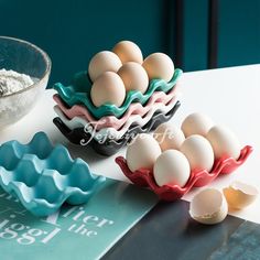 there are many different types of eggs in the bowls on the table next to each other